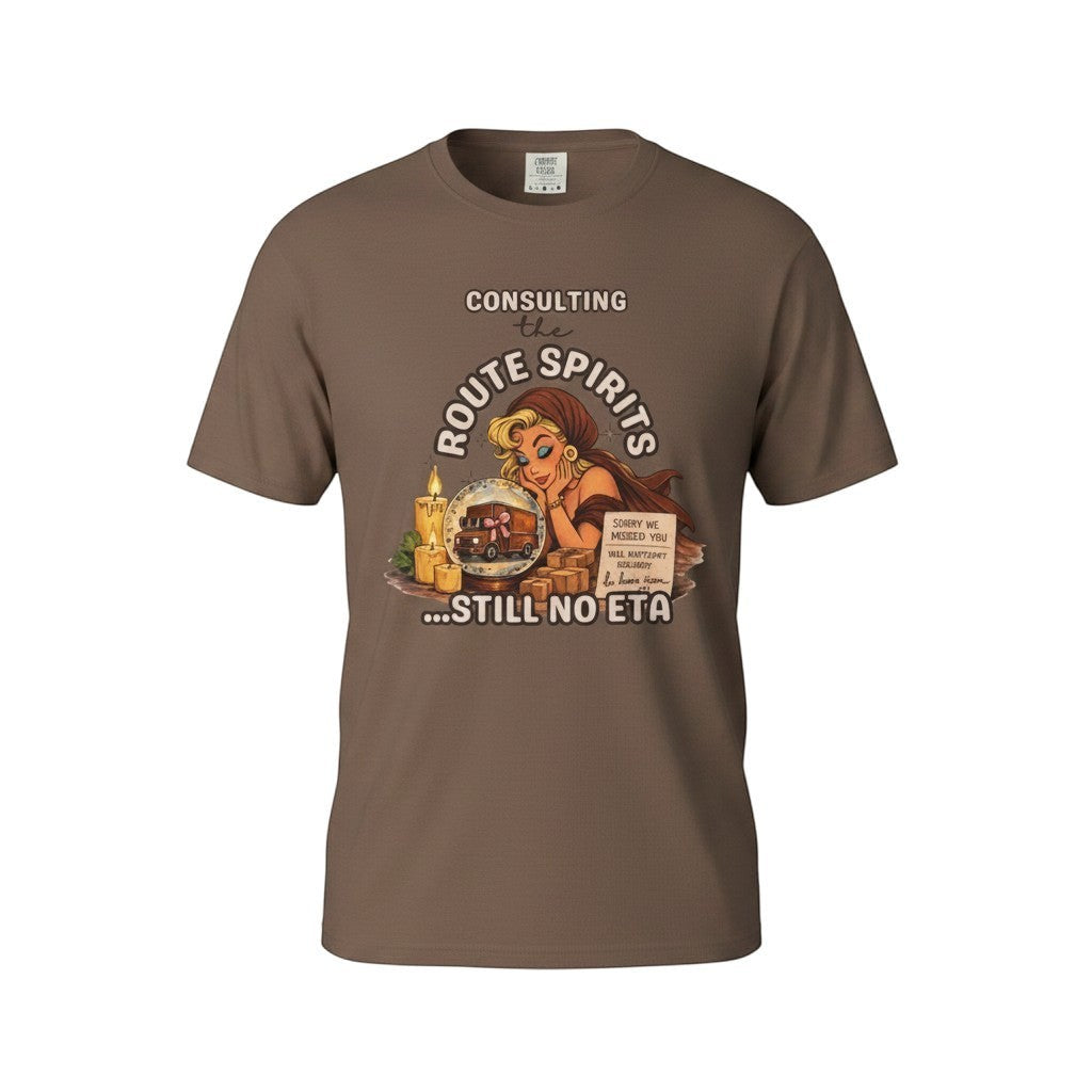 Route Society brown cotton graphic tee with "Consulting the Route Spirits... Still No ETA" text and vintage illustration.