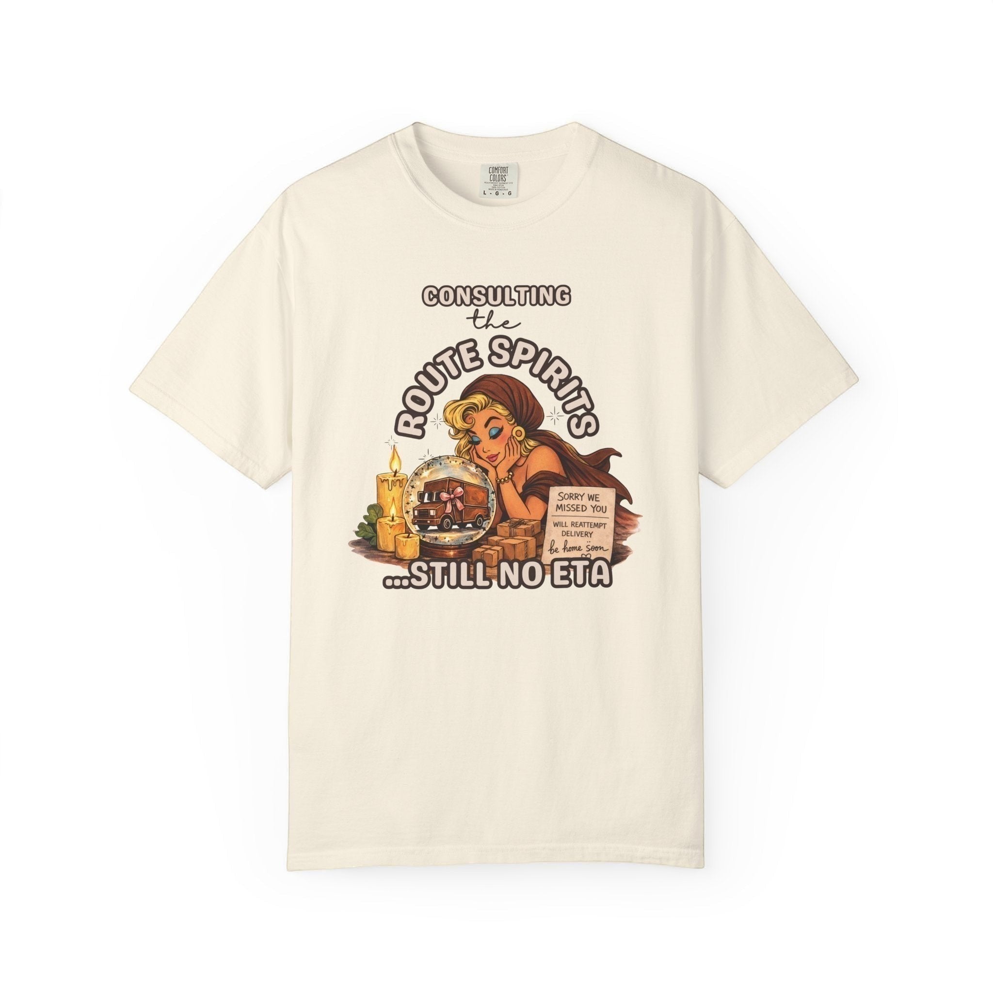 Route Society cream cotton graphic tee with "Consulting the Route Spirits...Still No ETA" text and vintage illustration.