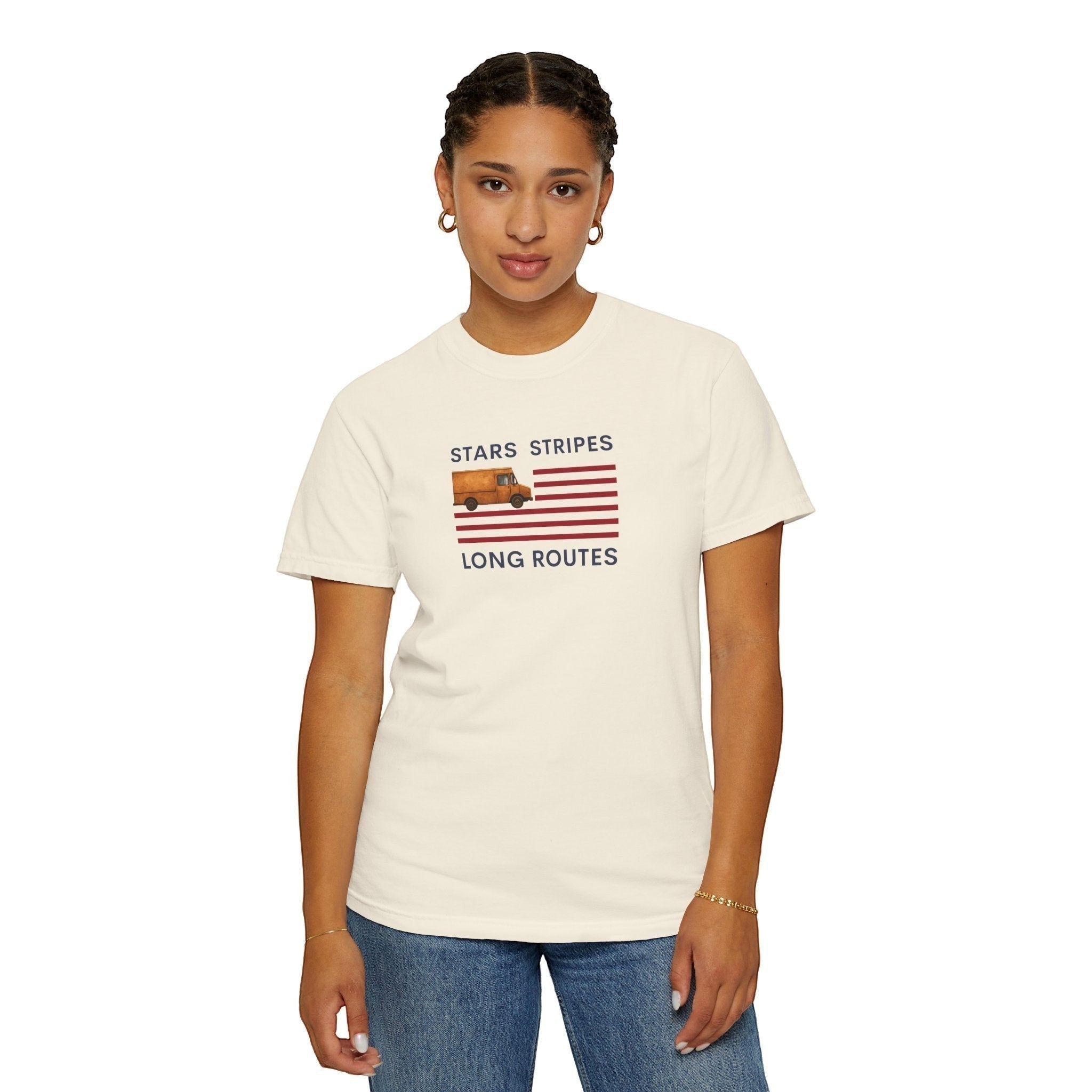 Route Society cream cotton tee with "Stars Stripes & Long Routes" graphic featuring a vintage delivery truck on an American flag.