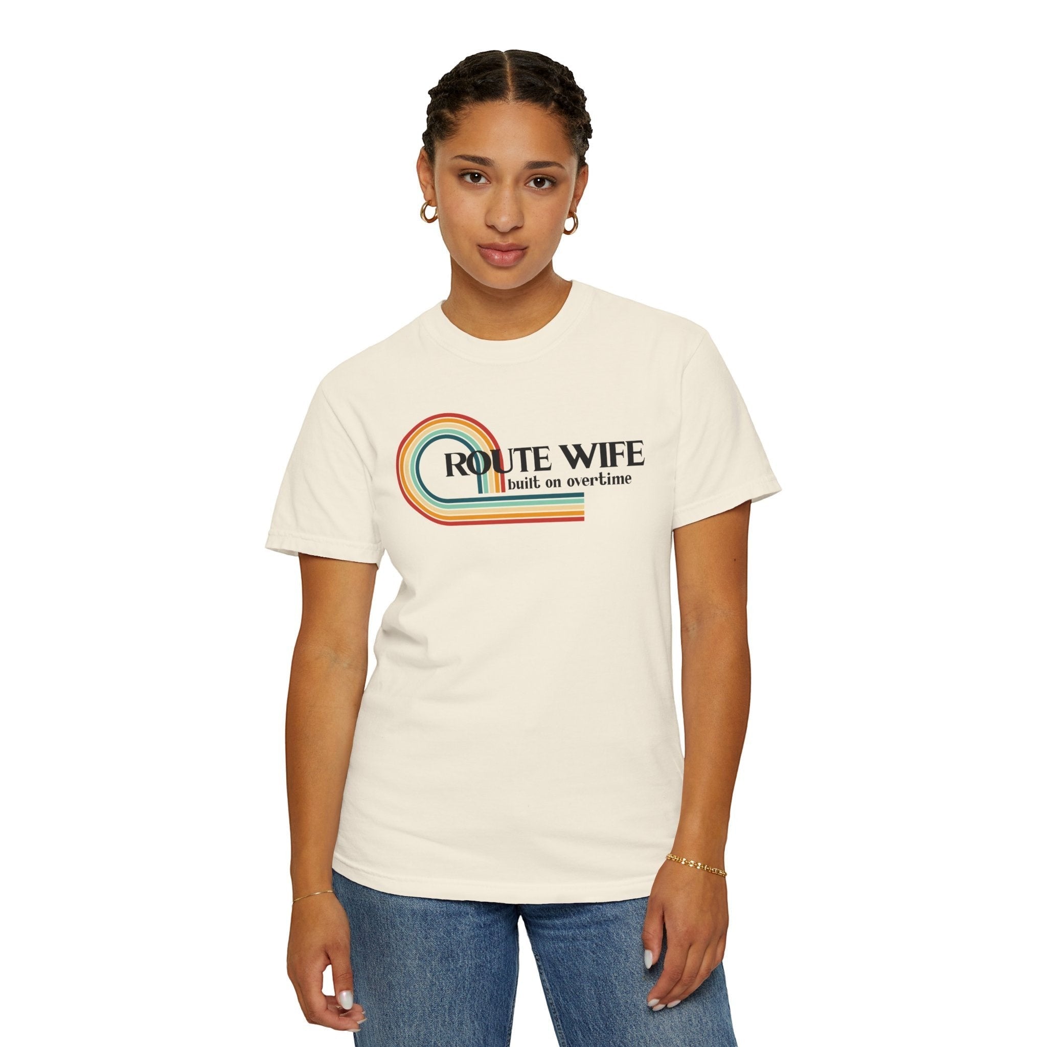 Route Society cream cotton tee with retro rainbow graphic and "Route Wife built on overtime" text.